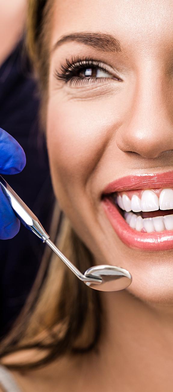 Woman getting routine dental exam in Sacramento